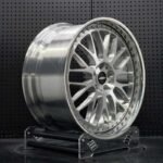 XL DUAL SERIES-001 deep stepped lip two-piece forged rim angled view showing barrel depth and perimeter assembly bolts