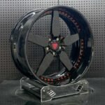 XL DUAL SERIES-002 aerospace 6061-T6 forged rim displaying gloss black 5-spoke contour and anodized red assembly bolts
