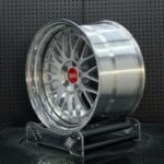 XL DUAL SERIES-004 aerospace 6061-T6 forged rim displaying silver cross mesh spokes, polished stepped dish, and red BBS emblem
