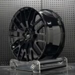 XL MONO SERIES-021 aerospace 6061-T6 aluminum forged rim displaying gloss black spoke contours and brake cooling ventilation