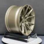 XL MONO SERIES-023 concave satin gold split-spoke forged rim angled view showing barrel depth and brake clearance
