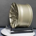 XL MONO SERIES-023 aerospace 6061-T6 aluminum forged rim displaying satin champagne gold finish and spoke pocketing