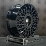 XL MONO SERIES-025 concave gloss black lattice mesh forged rim angled view showing barrel depth and concave spoke drop