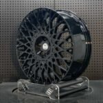XL MONO SERIES-025 aerospace 6061-T6 forged rim displaying intricate basketweave mesh spoke geometry and gloss black finish