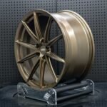 XL MONO SERIES-034 concave satin bronze split-spoke forged racing rim angled view showing barrel depth and spoke drop