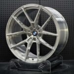XL MONO SERIES-038 aerospace 6061-T6 forged rim displaying skeletonized spoke pocketing and hand-brushed aluminum grain
