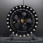 XL OFF-ROAD SERIES-004 gloss black Fuchs-style off-road forged wheel front face with Porsche crest center cap and milled beadlock pockets