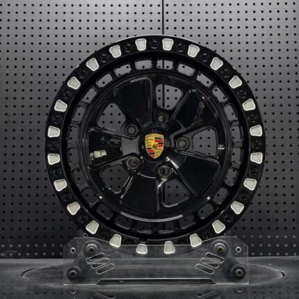 XL OFF-ROAD SERIES-004 gloss black Fuchs-style off-road forged wheel front face with Porsche crest center cap and milled beadlock pockets